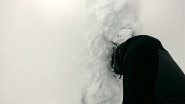 Snowshoe walker running in powder snow. Outdoor winter activity and healthy lifestyle. POV view