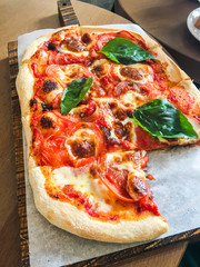 Italian pizza on a wooden Board