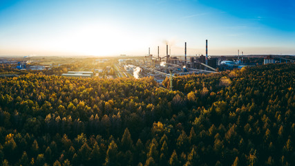 industrial landscape with heavy pollution produced by a large factory - obrazy, fototapety, plakaty