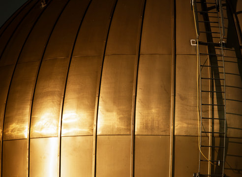 Golden dome with attached metal ladder