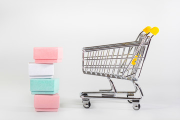 Supermarket boxes and cart at the white background.