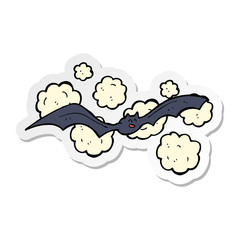 sticker of a cartoon spooky bat