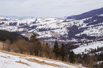 Fototapeta na wymiar Winter landscape in the Carpathian mountains with gutsul culture.