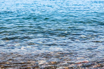 The view of the sea. Small waves and the sea. Close up.