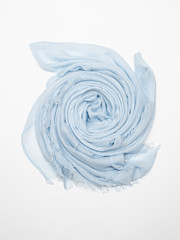 Blue scarf on white background. Top view.