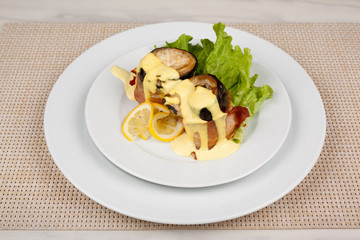 Eggplant and bacon rolls with cheese, lemon and green salad.