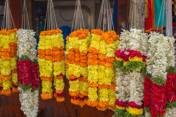 bright colorful wreaths of fresh flowers sold on the market