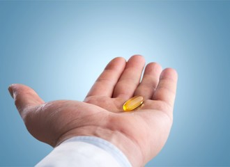 Girl eating lots of pills on background