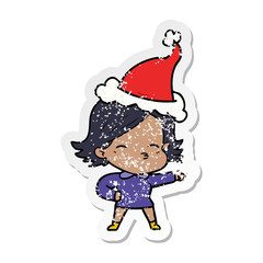distressed sticker cartoon of a woman pointing wearing santa hat
