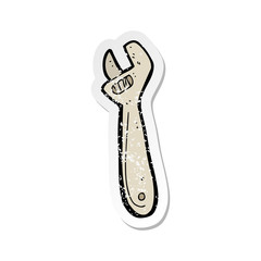 retro distressed sticker of a cartoon adjustable spanner