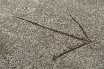 arrow sign on ground selective focus