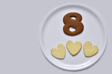 Shaped cookies in the shape of hearts and eight.
