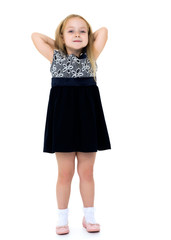 Little girl posing in studio on a white background.
