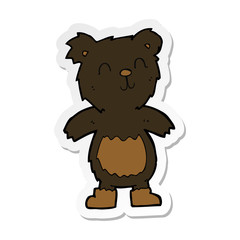 sticker of a cartoon teddy black bear