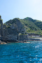 Italy,Cinque Terre,Riomaggiore, a large body of water with a mountain in the background