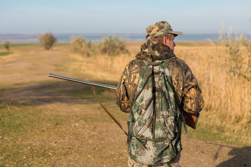 Hunters with a german drathaar and spaniel, pigeon hunting with dogs in reflective vests