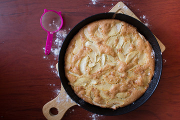 Charlotte pie pan. Apple pie. Homemade baking. Cook at home. Cast-iron pan.