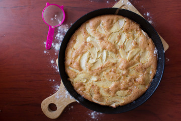 Charlotte pie pan. Apple pie. Homemade baking. Cook at home. Cast-iron pan.