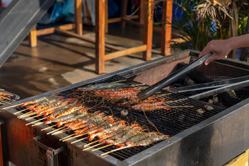 Prawns on a coal-fired grill.