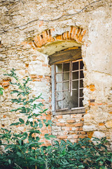 Window in the old dilapidated medieval castle_
