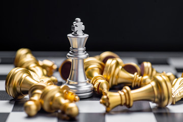 Chess (King wins the game) on black background. Success, business strategy, victory, win, winner, intellect, tactics, defeat, beat, knock, checkmate, leader or leadership concept.