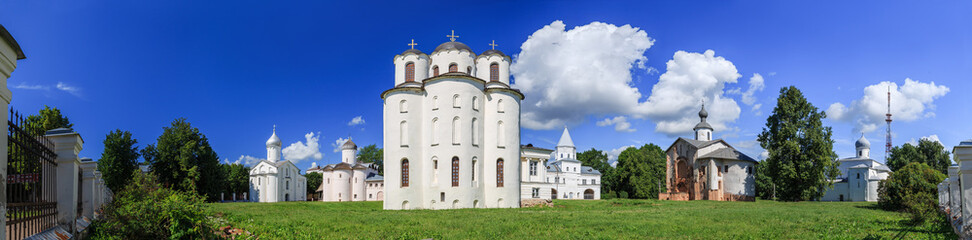 Fototapeta na wymiar Veliky Novgorod, Russia. Panorama of ancient churches on Yaroslav Courtyard in historical center.