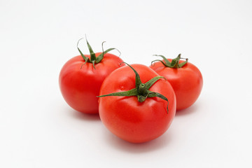 Bunch of ripe tomatoes isolated on white background