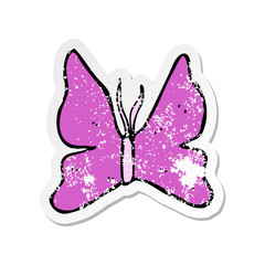 retro distressed sticker of a cartoon butterfly symbol