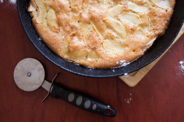 Charlotte pie pan. Apple pie. Homemade baking. Cook at home. Cast-iron pan.