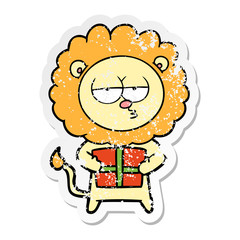 distressed sticker of a cartoon bored lion with present