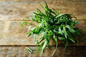 Fresh Tarragon Bunch on a dark wood background