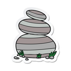 sticker of a cartoon large stacked stones