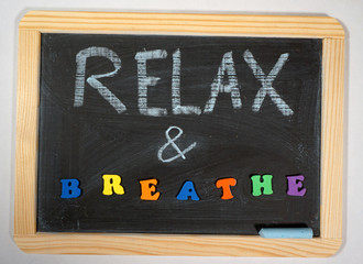 Fototapeta na wymiar Positive relaxation message on chalkboard