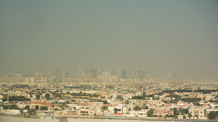 Dubai's buildings seen from the airplane taking off