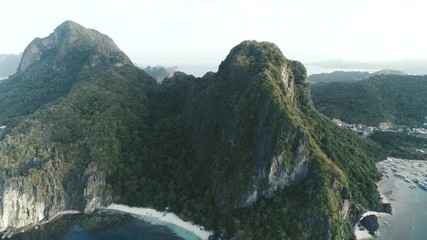 Aerial drone shot of high mountain covered with tropical forest. Tropical landscape. Travel concept Philippines,El Nido.