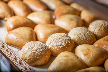 buns and pastries in a basket on the bakery shop window