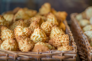 biscuits and pastries in the basket on the display of the bakery