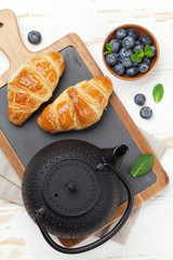 Tea and croissants breakfast