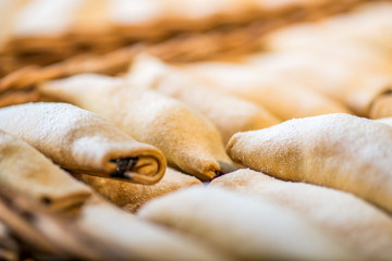 biscuits and pastries in the basket on the display of the bakery