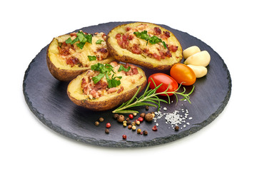 Hot Baked stuffed Potatoes with cheese, bacon, parsley, close-up, isolated on white background