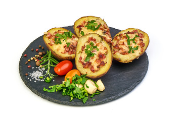Delicious stuffed potatoes with cheese and bacon, close-up, isolated on white background