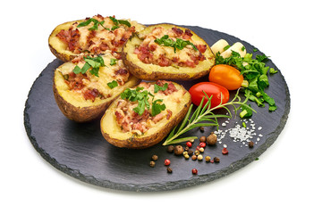 Hot Baked stuffed Potatoes with cheese, bacon, parsley, close-up, isolated on white background