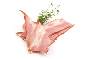Sliced Smoked bacon, pork brisket with rosemary, american food, close-up, isolated on white background