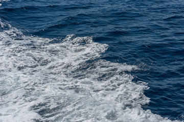 Italy,Cinque Terre,Riomaggiore,white frothing waves in the ocean