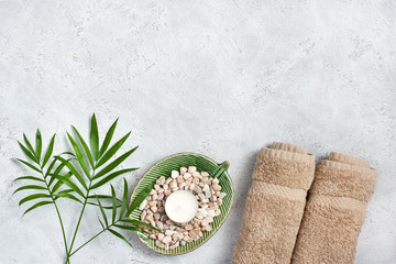 Spa stones and leaves on grey background