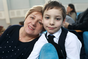 Grandmother and grandson in theater