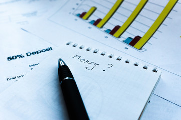 Businessman analyzing investment charts and statement and financial report