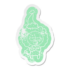 cartoon distressed sticker of a tired lion wearing santa hat