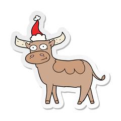 sticker cartoon of a bull wearing santa hat