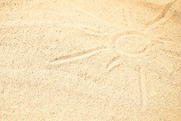 Beautiful drawing on the sand of the sea background